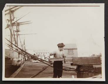 Photograph - Photograph, Sepia, Mr and Mrs Gurney Goldsmith, Landing lumber on the South Side of the Yarra - Apprentice measuring wood, 1906