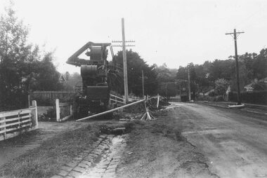 Photograph, Adelaide Street, Ringwood, being dug up to lay sewerage pipes from Civic Place. 1959