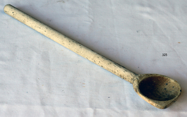 Round handled wooden spoon, light coloured with dark flecks