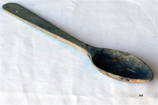 Wooden spoon made of blonde timber with thick handle