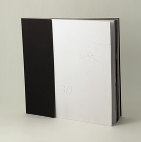 Double card blind embossed cover (white smooth card and black textured card), perfect/burst bound, cover.