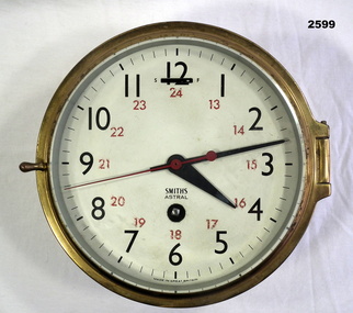 Circular brass cased Navy clock.