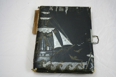 Album, Photograph album bound in dark brown faux leather embossed with image of a sailing ship and various nautical flags, highlighted with gold and silver leaf, with metal clasp, not known