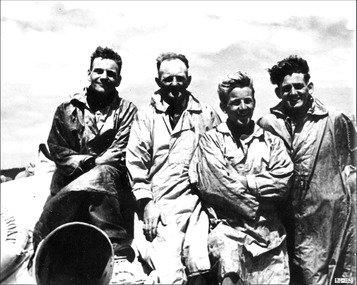 B & w photo of 4 lifeboat crew