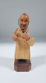 Sculpture - Carved wooden figurine of a doctor