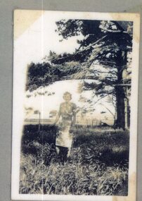 Photograph of standing woman