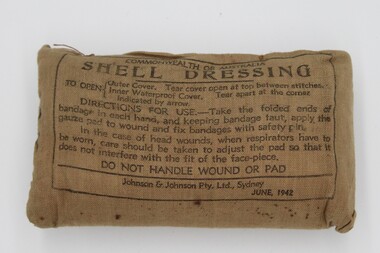 A small padded brown rectangular parcel with instructions printed on the front in black. Outer fabric is hessian.