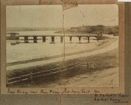 Black and white photograph of the new bridge over the river Moyne with fence in foreground