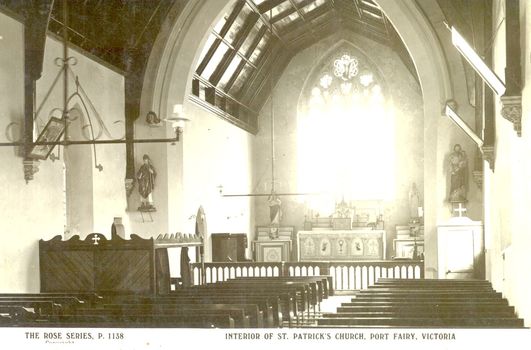 Interior looking toward the altar and the 4 panel arched windows