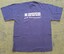 Royal blue tshirt with Association for the Blind - New Beginnings TM in white writing on back