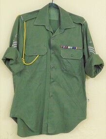 Army shirt with rolled sleeves and cord round sleeve.