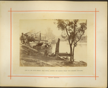 View of the River Murray, near Echuca, showing the Railway Wharf with steamers unloading / [by] Nicholas Caire, circa 1876