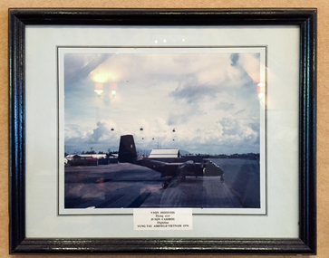 Photograph, Iroquois flying over Caribou at Vung Tau Airfield