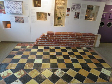 Image showing tiles on floor, brick wall and interpretation panels