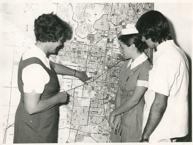 Royal District Nursing Service (RDNS) Supervisor showing the Footscray Centre area map to Student nurses from Western General Hospital
