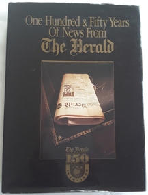 A large brown hardcover book, One Hundred & Fifty Years of News from The Herald newspaper in Australia from 1840 - 1990