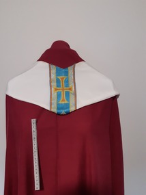 Ceremonial object - Stole, White synthetic stole. Symbol of cross embroidered in orange, yellow and blue