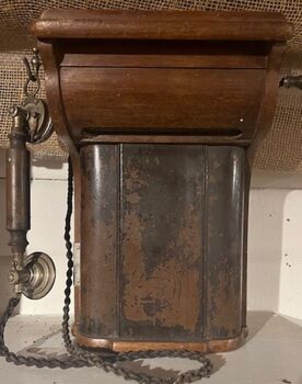 Telephone showing handle and cable.