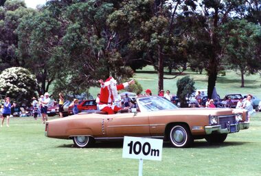 Photograph, Faye Lamb, Christmas picnics at Heidelberg Golf Club - Santa arrives in old car, 1990