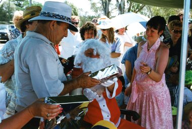 Photograph, Faye Lamb, Christmas picnics at Heidelberg Golf Club - Santa distributing gifts, 1990