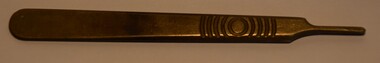 A Swann-Morton scalpel handle made in England after 1932. 
