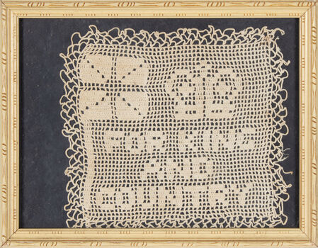A doily crochet in cotton, mounted on a black background, placed under glass in a cream coloured timber frame.