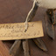 Close up of paper tag on left leg and metal tag on right leg