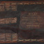 The front cover of a brown leather bound book with embossed gold lettering 