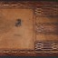 The back cover of a brown leather bound book