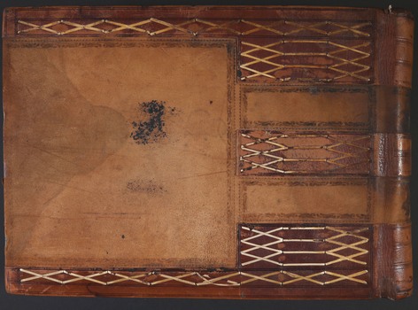 The back cover of a brown leather bound book