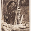 Black and white photograph featuring mining machinery in the center of the photograph