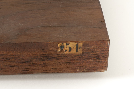 Label on pedestal stating "54"