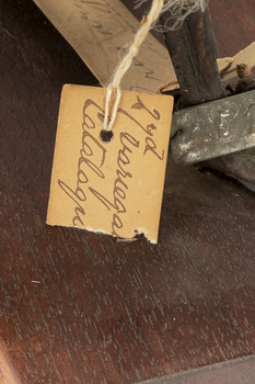 Close up of the paper tag tied to leg of the Pacific Gull