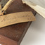 Close up of paper tag tied to leg of Common Gull