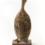 Pacific Black Duck standing on wooden mount looking forwards 
