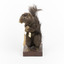 Carolina Squirrel standing on a wooden platform facing front and looking right