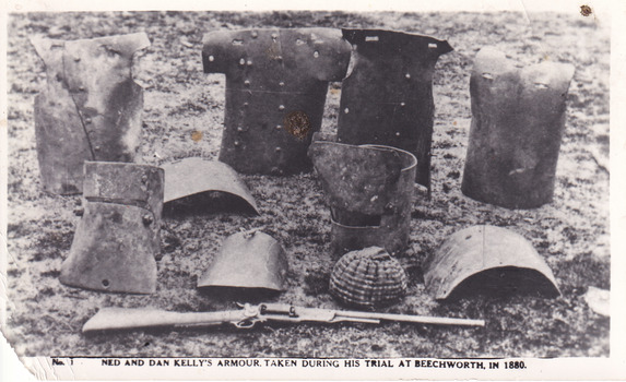 A postcard depicting 10 pieces of Kelly Gang armour and gun, including breast plates and helmets.