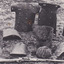 A postcard depicting 10 pieces of Kelly Gang armour and gun, including breast plates and helmets.