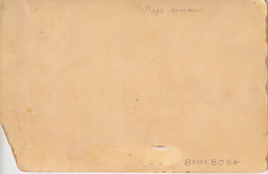Reverse of the photograph showing a blank card with some inscription