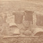 Sepia photograph of the Kelly Gang armour sitting on the ground. 