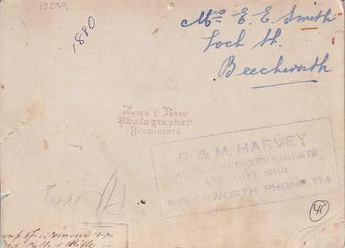 Brown-toned background with various pieces of handwriting and stamped lettering.