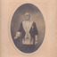 The portrait of the older man in uniform, with a handlebar moustache, in an oval frame. The words Courtnei's Thelma Studios is on the bottom right hand corner of the photo frame