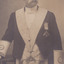 A portrait of a man, who is older in age. He is in uniform and has a handlebar moustache.