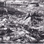 Photograph of mining operations, including buildings, tracks and mines.