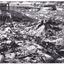 Photograph of mining operations, including buildings, tracks and mines. Cropped image