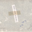 Rear of an aged photograph. The colour is grey with some tears in it.