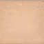 Rear of an aged photograph. Colour is tan with dark and light spots visible and fraying around the edges.