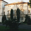 Photograph of Mayday Hills Hospital façade with two cars visible in the image.