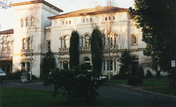 Photograph of Mayday Hills Hospital façade with two cars visible in the image.