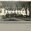 Photograph of mental hospital staff, nurses and male workers. 17 men in 2 rows, with a row of female nurses in between. 2 men in the photo have 'Kepi' style hats.